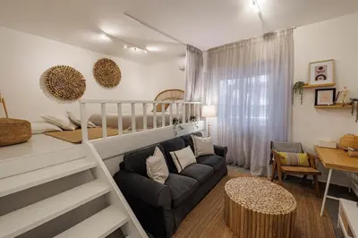 a living room with a bunk bed and a couch at Sunlit homie flat at Arrianou! in Athens
