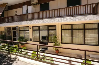 a building with windows and plants on the balcony at Lime house in Athens