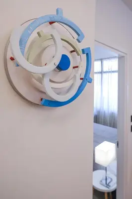 a large mirror hanging on a wall in a room at Lime house in Athens