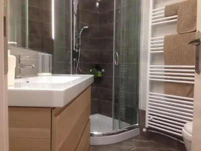 a bathroom with a sink and a shower at Quiet, central, on airport metro and bus line in Athens
