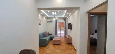 a living room with a couch and a table at Near the Pasha Limani in Piraeus