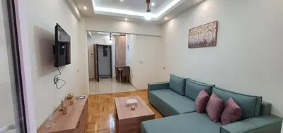 a living room with a couch and a table at Near the Pasha Limani in Piraeus