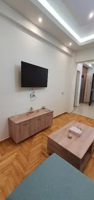 a living room with a flat screen tv on a wall at Near the Pasha Limani in Piraeus