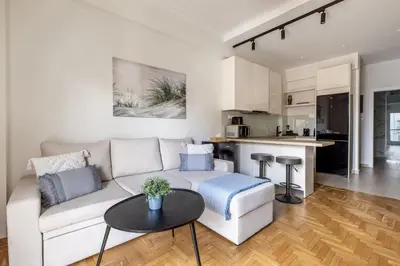 a living room with a couch and a table at Attica - Captivating 2-Bedroom Apt & Balcony in Athens in Athens