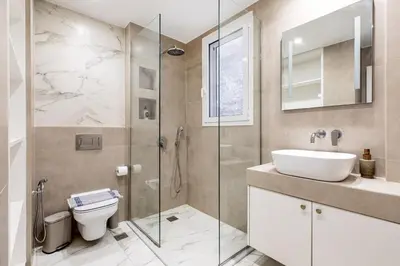 a bathroom with a toilet and a sink and a shower at Attica - Captivating 2-Bedroom Apt & Balcony in Athens in Athens