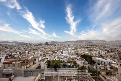 a view of a city under a cloudy sky at Kastella Luxe Stone in Piraeus