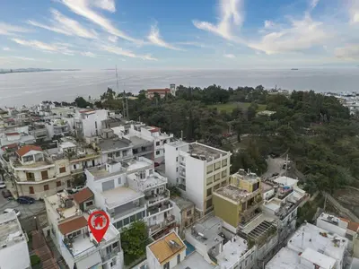 an aerial view of a city with buildings at Kastella Luxe Stone in Piraeus
