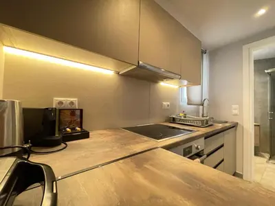a kitchen with a sink and a counter top at Athenean Cozy Nest in Athens