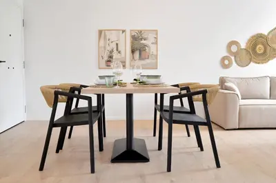 a dining room table with two chairs and a couch at Athinais Park Acropolis View in Athens