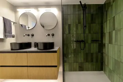 a bathroom with a sink and a shower at Athinais Park Acropolis View in Athens