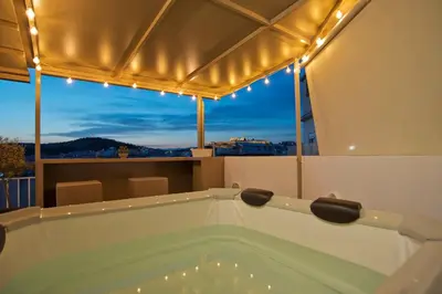 a jacuzzi tub in a room with a view at Kary's Acropolis View Luxury 2BR, 2 BA, Jacuzzi in Athens