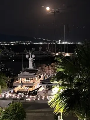 a large boat docked in a marina at night at Zea Sea View Apartment in Piraeus