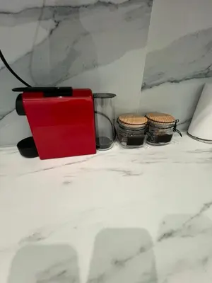 a red box sitting on a counter with three drums at Zea Sea View Apartment in Piraeus