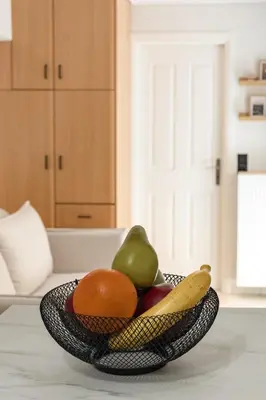 a bowl of fruit sitting on a table at Atherial Studio in Athens