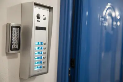 a close up of a remote control on a wall at Aimou Suites in Piraeus