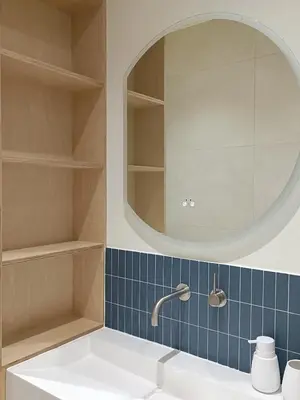 a bathroom with a sink and a mirror at Luxury Residency II Filolaou Blue in Athens