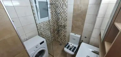 a small bathroom with a toilet and a sink at A few minutes from Siggrou Street in Athens