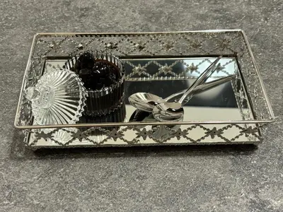 a silver box with a comb and other items in it at Elysian Αpartment II in Athens