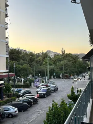 a bunch of cars parked in a parking lot at Elysian Αpartment II in Athens