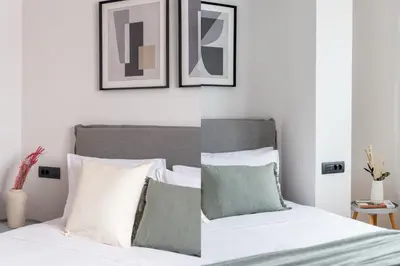 a bedroom with a bed with white and green pillows at The Exarchia Hideout by UPSTREET in Athens