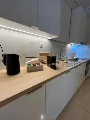 a kitchen with a counter top with a sink at J&N Living in Spáta