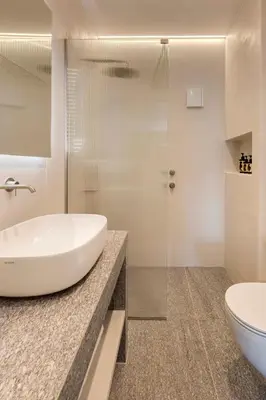 a white bathroom with a sink and a toilet at Spacious Athenian escape, Koukaki in Athens