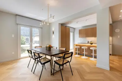 a kitchen and dining room with a table and chairs at Spacious Athenian escape, Koukaki in Athens