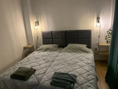 a bedroom with a bed with two bags on it at Renovated appartment, near Metro in Athens