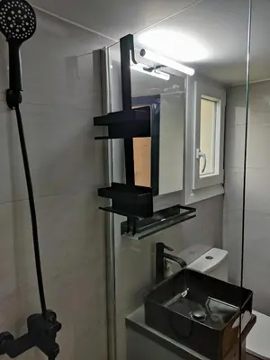 a bathroom with a sink and a mirror at Renovated appartment, near Metro in Athens