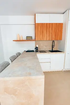 a kitchen with a large marble counter top at Luxury Superior Suite in Glyfada in Athens
