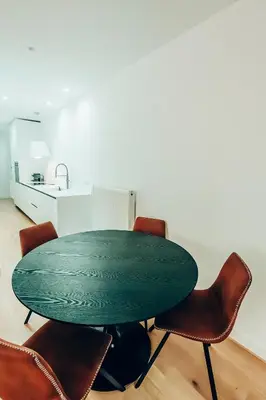 a green table and chairs in a room at Dreamy Glyfada Apartment in Athens