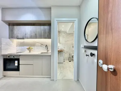 a kitchen with a sink and a counter at Larisis Cozy Corner in Athens