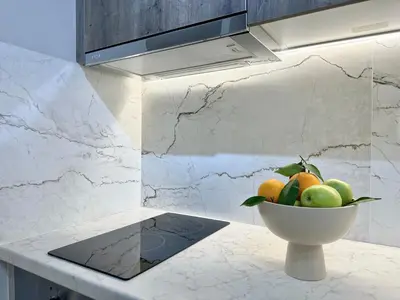a bowl of fruit on a counter in a kitchen at Larisis Cozy Corner in Athens