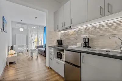 a kitchen with a sink and a counter top at Kallari Serenity Apartment in Athens