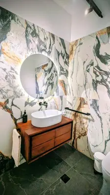a bathroom with a sink and a mirror at Avenue of Gods - Irakli's Retreat in Athens