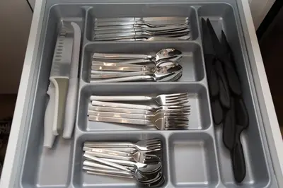 a plastic container filled with forks and spoons and forks and knives at K11 Apartment in Athens