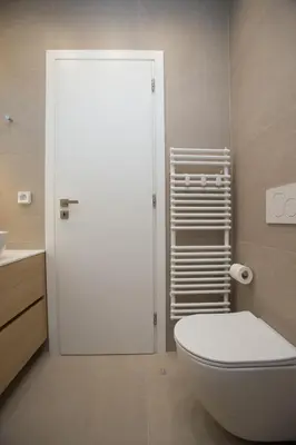 a bathroom with a white toilet and a sink at K11 Apartment in Athens