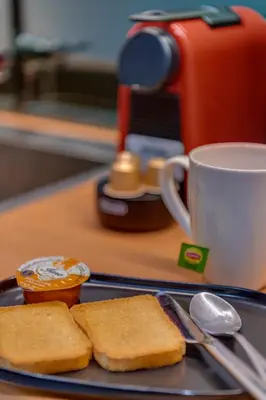 a plate of toast and a cup of coffee on a table at Rafael Apartment Ampelokipoi in Athens