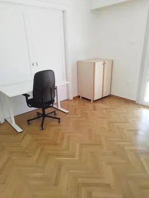 an office with a chair and a desk and a box at Berry room 2 in Athens