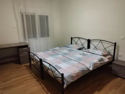a bedroom with a bed and a dresser at Berry room 5 in Athens