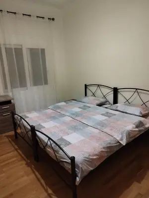 a bedroom with a bed with a blanket on it at Berry room 5 in Athens