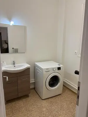 a washing machine in a bathroom with a sink at Berry room 5 in Athens
