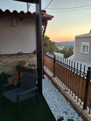 a view from the back yard of a house at Boutique Eptalofos 2 15min from airport and sea in Kouvarás