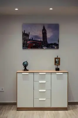 a desk in a room with a picture of big ben at Big London Apartment in Piraeus in Piraeus