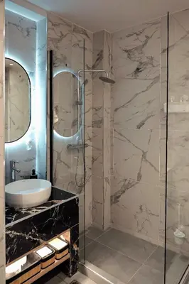 a bathroom with a sink and a shower at Big London Apartment in Piraeus in Piraeus