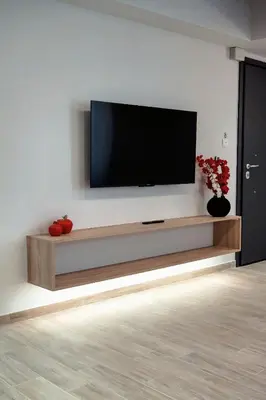 a living room with a flat screen tv on a wall at Big London Apartment in Piraeus in Piraeus