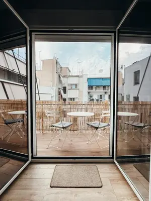 a view of a balcony with a table and chairs at Sunlit luxurious flat at pagrati! in Athens