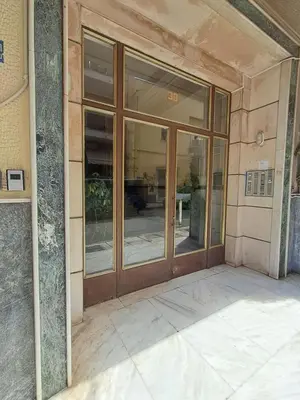 an entrance to a building with glass doors at Reina in Athens