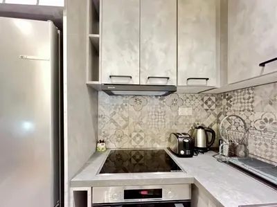a kitchen with a sink and a refrigerator at Home away from home in Athens