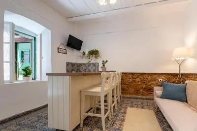 a living room with a bar and a couch at The Psyri Collection in Athens